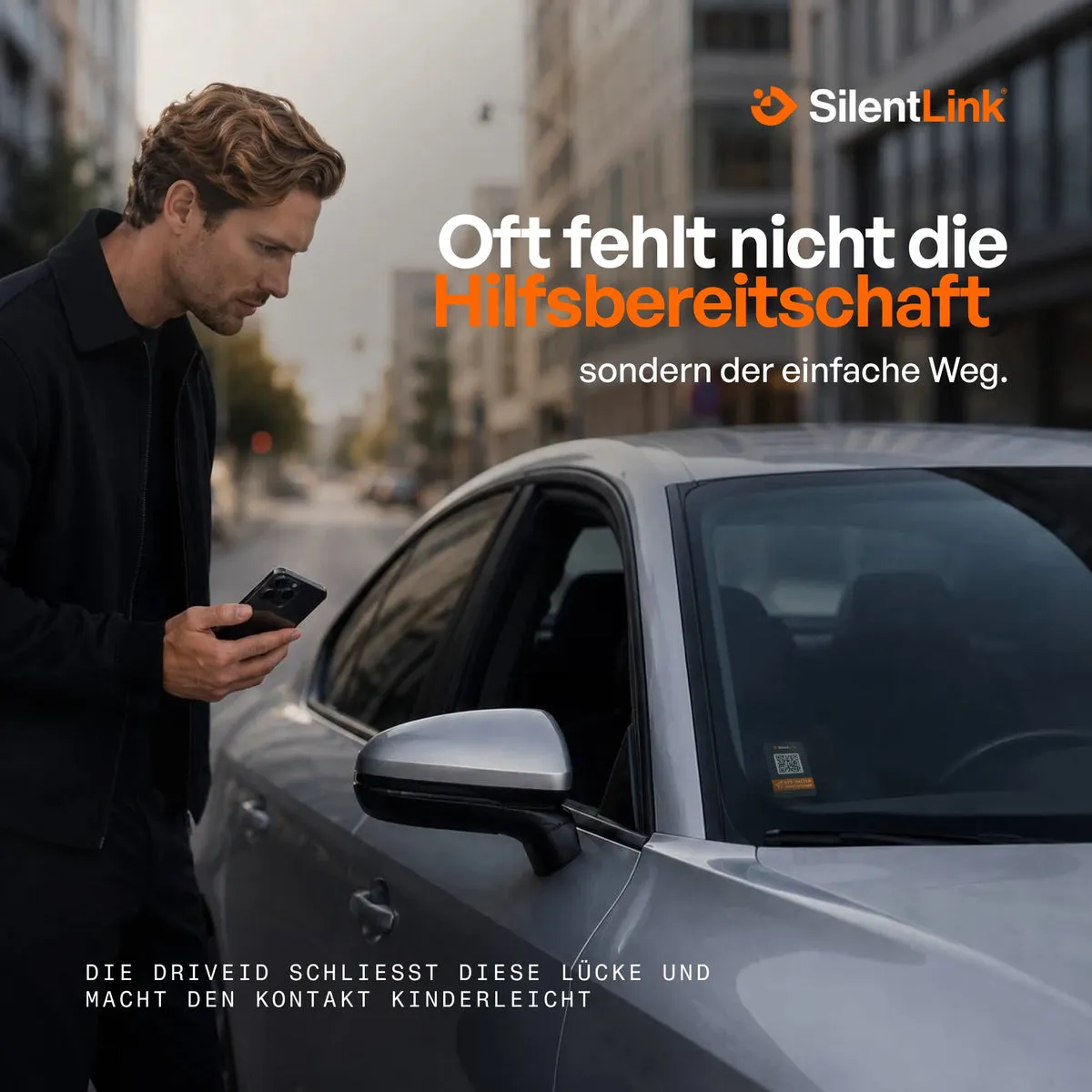 Oft fehlt nicht die Hilfsbereitschaft, sondern der einfache Weg – Passant mit Smartphone am Auto